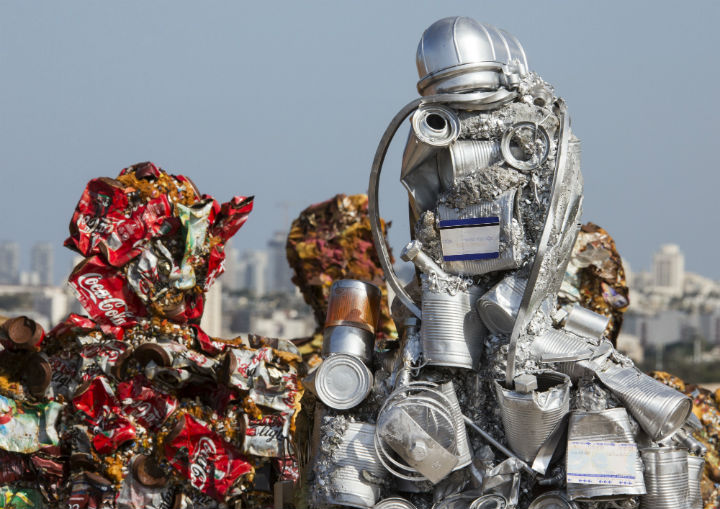 Hundreds of human-size figures constructed from 20 tons of recycled material, including iron, glass, computer parts, cans and more, are on display in Ariel Sharon Park until Apr. 26.