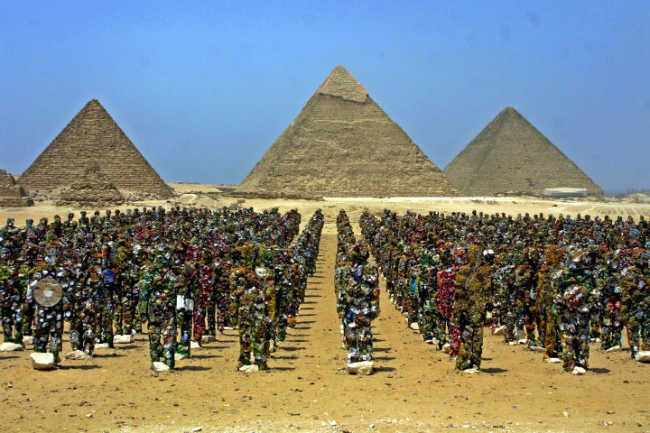 HA Schult's "Trash People" stand in front of the Pyramids of Giza.