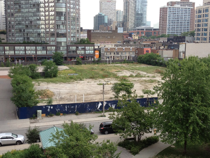 A plot of land sits empty at 11 Wellesley in Toronto.