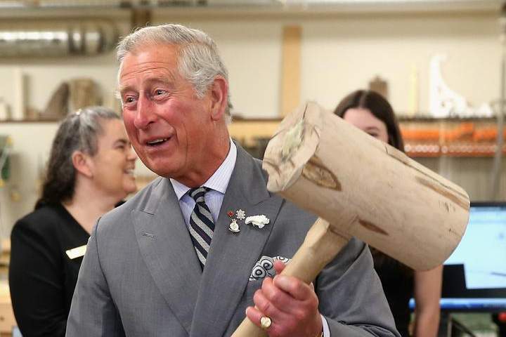 Prince Charles, Prince of Wales hammers in a peg with a giant mallet as he visits the woodwork department at the centre for applied science and technology at Holland College on Tuesday in Charlottetown. The Prince of Wales and Duchess of Cornwall will arrive in Winnipeg on Tuesday evening.