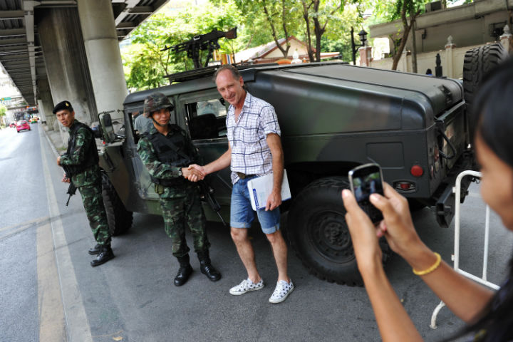 How is martial law affecting tourism in Thailand?