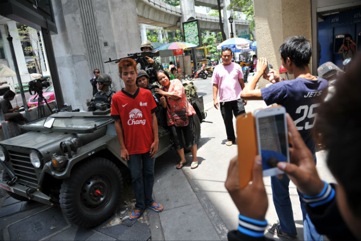 How is martial law affecting tourism in Thailand?
