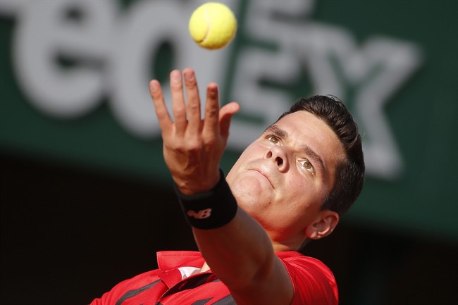 Milos Raonic serves in Paris in May 2014.