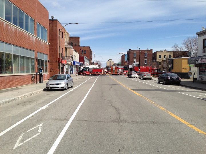 Firefighters worked hard to save the lives of two pedestrians trapped under a semi-trailer truck in Montreal on May 6, 2014.