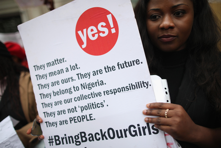 A woman holds a placard during a protest calling for the release of 276 abducted Nigerian schoolgirls outside Nigeria House on May 9, 2014 in London, England.