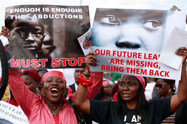 Women attend a demonstration calling on government to rescue the kidnapped school girls.