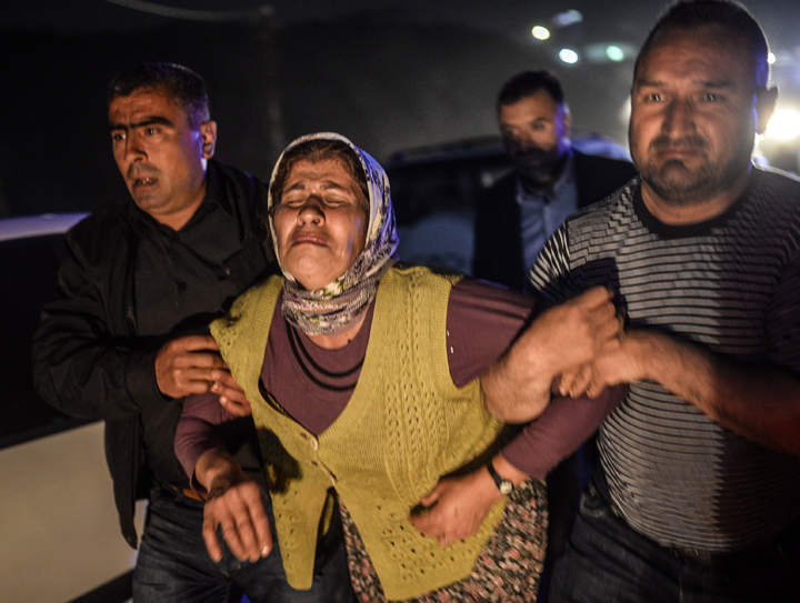 People cry after their relatives died in the explosion.
