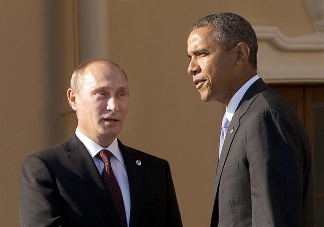 In this Sept. 5, 2013 file photo, President Barack Obama shakes hands with Russian President Vladimir Putin during arrivals for the G-20 summit at the Konstantin Palace in St. Petersburg, Russia, Thursday, Sept. 5, 2013. 