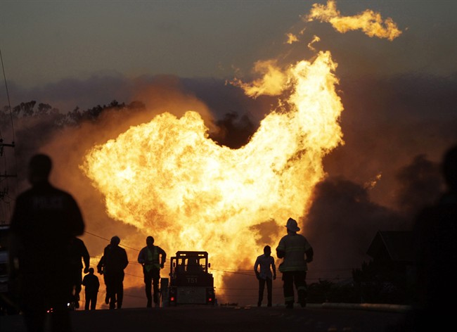 FILE - In this Sept. 9, 2010 file photo, a massive fire roars through a mostly residential neighborhood in San Bruno, Calif. A report released Friday by the Department of Transportation’s inspector general says the federal agency responsible for making sure states effectively oversee the safety of natural gas and other pipelines is falling down on the job. 