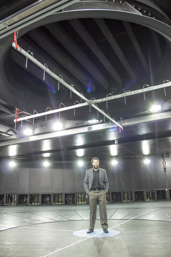 WindEEE operations manager Andrew Mathers stands below the massive fan at the facility.