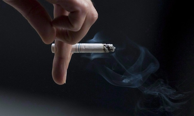 A person smokes in downtown Ottawa on Sept. 29, 2009. 