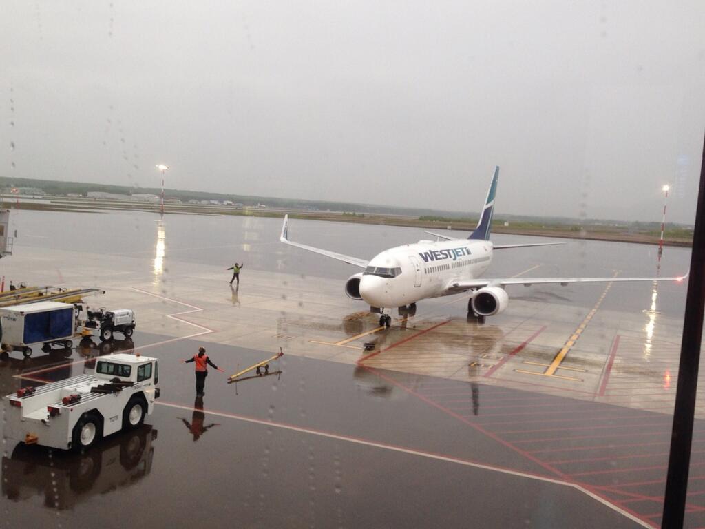 First flight arrives at Fort McMurray’s new international terminal, Monday, June 9, 2014.