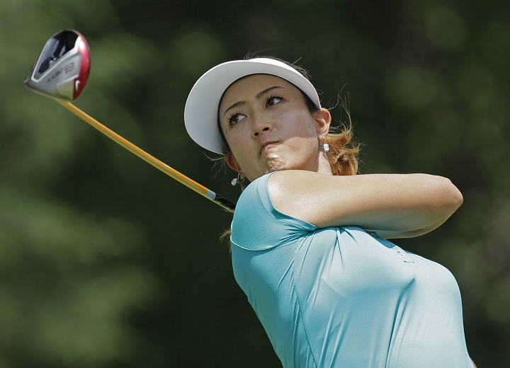 Michelle Wie watches her tee shot on the seventh hole during the final round of the U.S. Women's Open golf tournament in Pinehurst, N.C., Sunday, June 22, 2014. 