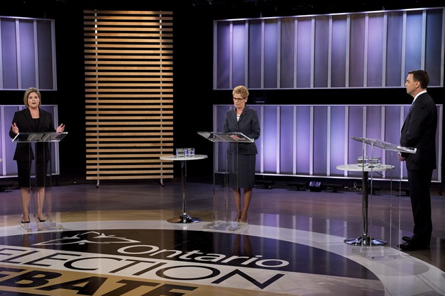 Ontario NDP leader Andrea Horwath, left, Ontario Premier Kathleen Wynne, centre, and Ontario PC leader Tim Hudak, right, take part in the live leaders debate at CBC during the Ontario election in Toronto on Tuesday, June 3, 2014. THE CANADIAN PRESS/Frank Gunn.