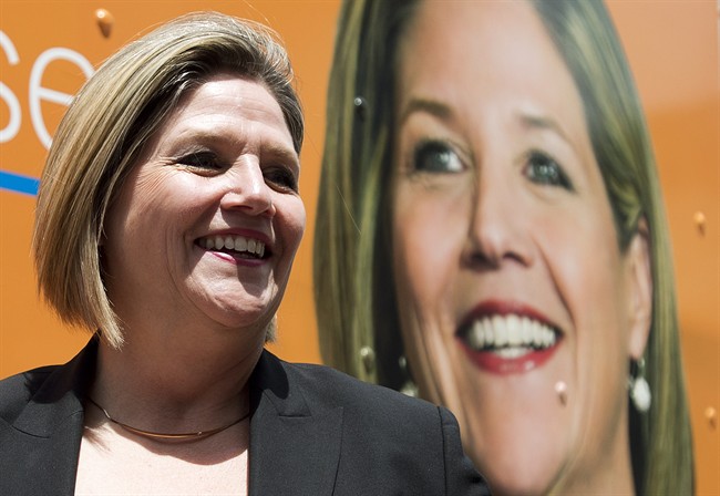 Ontario NDP leader Andrea Horwath leaves a rally during a campaign stop in Toronto on Friday, June 6, 2014.