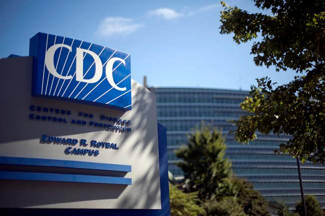 In this Oct. 8, 2013, file photo, a sign marks the entrance to the federal Centre for Disease Control and Prevention, in Atlanta. 