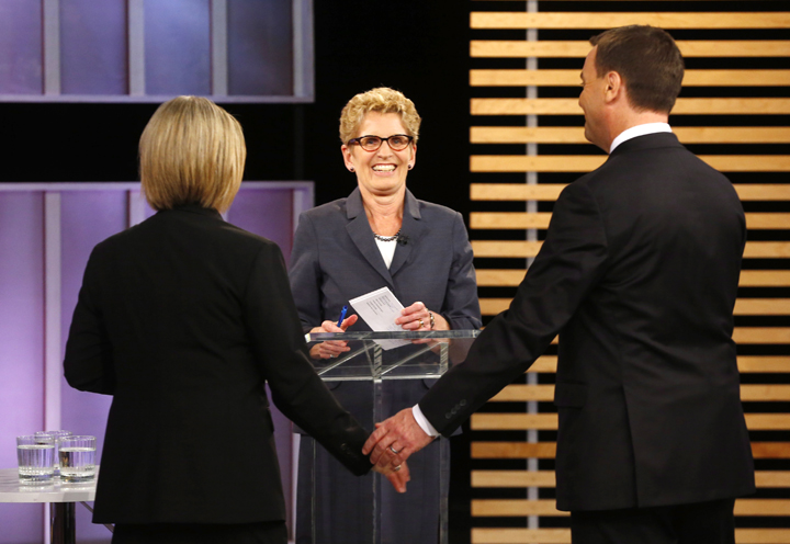 Ontario NDP leader Andrea Horwath, Ontario Premier Kathleen Wynne, centre, and Ontario Progressive Conservative leader Tim Hudak speak after taking part in the Ontario provincial leaders debate in Toronto, Tuesday June 3, 2014. 