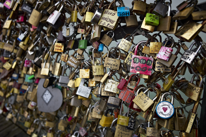 Padlocks adorn the railing of the Pont des Arts pedestrian bridge over the river Seine in Paris, France, Thursday, April 4, 2013.