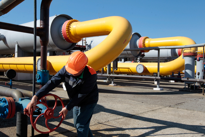 FILE - In this Wednesday May 21, 2014 file photo, a Ukrainian worker operates a valve in a gas storage point in Bil 'che-Volicko-Ugerske underground gas storage facilities in Strij, outside Lviv, Ukraine. Russia on Monday, June 16, 2014, cut gas supplies to Ukraine as a payment deadline passed and negotiators failed to reach a deal on gas prices and unpaid bills amid continued fighting in eastern Ukraine. The decision does not immediately affect the gas flow to Europe, but could disrupt the long-term energy supply to the region if the issue is not resolved, analysts said. 