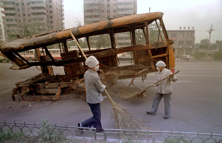 Jeff Widener’s photo of a burned out bus in Beijing in June 1989, when the government cracked down on pro-democracy protesters in Tiananmen Square.