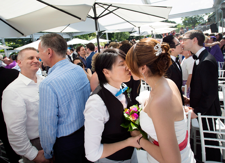 Over 100 gay couples participate in a mass wedding during World Pride 2014 at Casa Loma in Toronto, Ont. on Thursday, June 26, 2014.
