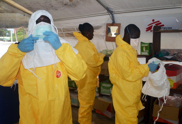 Doctors Without Borders (MSF) put on protective gear in an Ebola treatment ward in this file image.