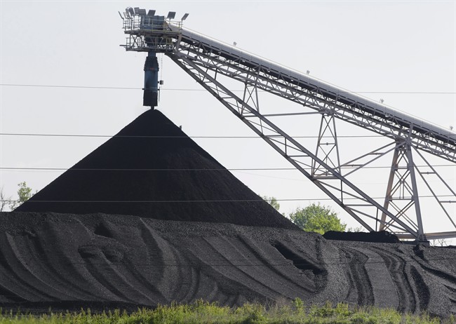 FILE - In this June 2, 2014 file photo, a hill of coal is seen at the North Omaha Station, a coal-burning power station, in Omaha, Nebraska. Hundreds of people have signed up to tell the EPA what they think of proposed rules to cut pollution from power plants during public hearings to take place in Denver on July 29 and 30, 2014. (AP Photo/Nati Harnik, File).