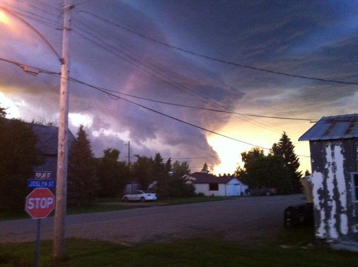 The storm threatens Hartney, Man., on Saturday. A tornado touched down nearby.