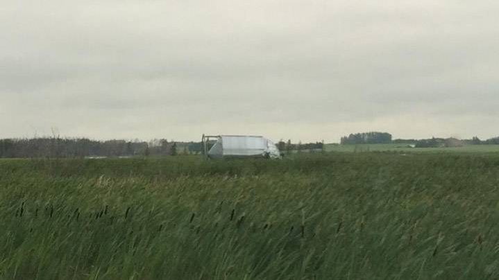 These are just south of Saskatoon (not far from the SIR racetrack) – the lonely grain bin is actually supposed to be on the other side of the highway with the other two grain bins (one of which is over too)