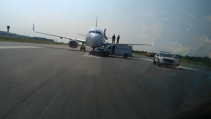 Alain Alphonso posted images of the tactical team and the Sunwing plane on his Facebook page.