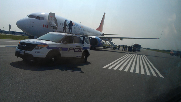 Alain Alphonso posted images of the tactical team and the Sunwing plane on his Facebook page.