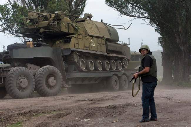 Ukrainian government forces maneuver antiaircraft missile launchers Buk as they are transported north-west from Slovyansk, eastern Ukraine Friday, July 4, 2014. (AP Photo/Dmitry Lovetsky).