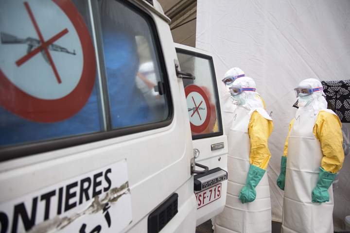 During a training session participants simulate loading a patient into an ambulance during a training course to instruct non-governmental organisation workers and doctors on how to deal with the Ebola virus in Brussels on Tuesday, Aug. 26, 2014. 