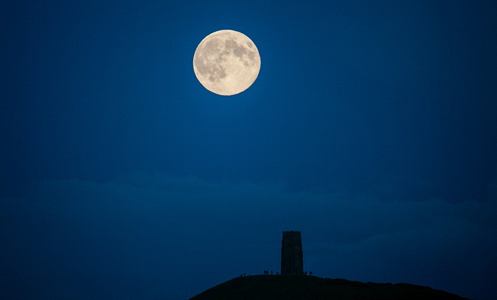 The moon rises above Glastonbury Tor on August 10, 2014 in Somerset, England.