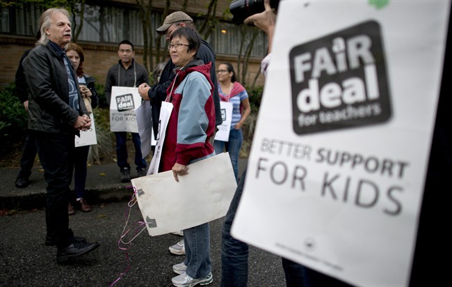 Former British Columbia Teacher Federation (BCTF) President Jim Iker is seen outside the Britannia Secondary and Elementary Schools in Vancouver, Tuesday, Sept. 2, 2014, during the last BCTF strike.