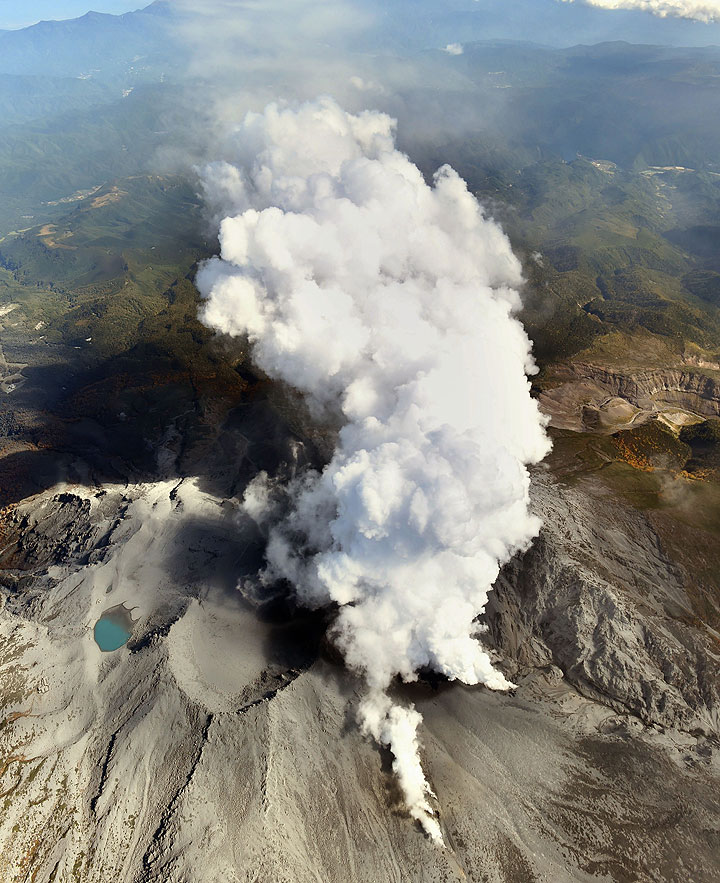 Volcanic gases and ash billow from the peak crater of Mount Ontake in central Japan Tuesday afternoon, Sept. 30, 2014.