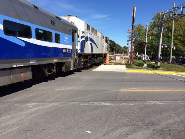 An AMT commuter train pulls out of the station on the Island of Montreal.