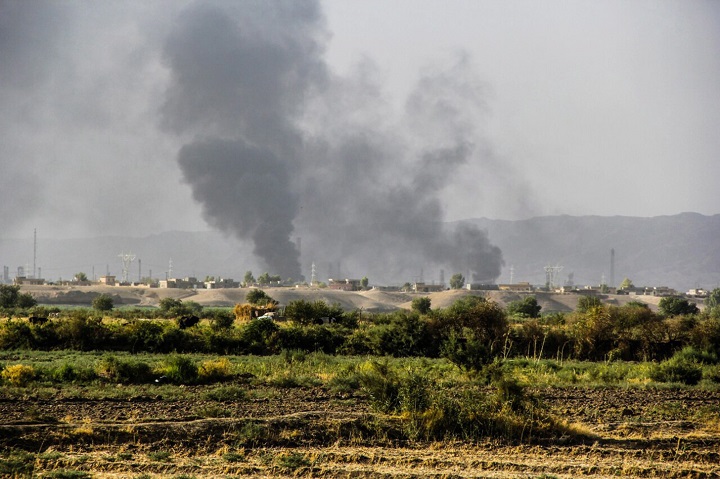 In this Thursday, July 31, 2014 photo, smoke rises from an oil refinery in Beiji, some 250 kilometers (155 miles) north of Baghdad, Iraq, after an attack by Islamic militants.