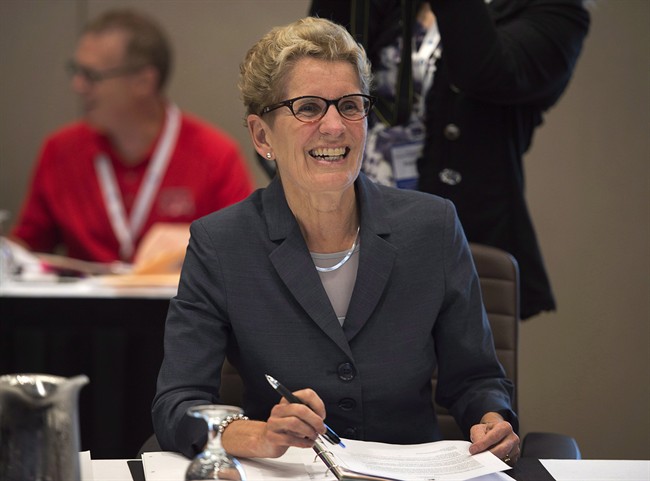 Ontario Premier Kathleen Wynne smiles at the start of a session at the annual Council of the Federation meeting in Charlottetown on Friday, August 29, 2014. 