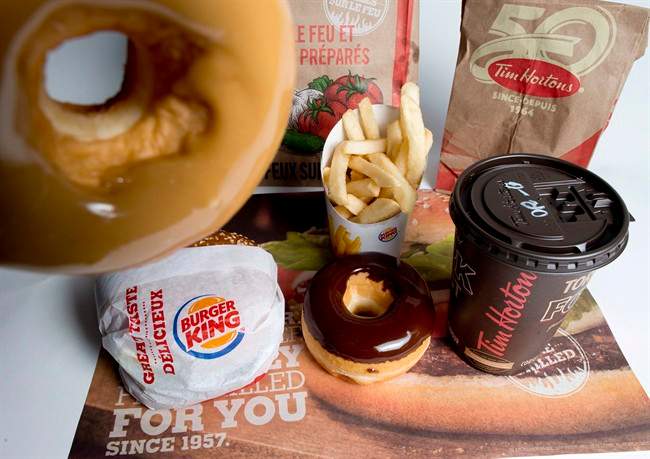 Tims and Burger King will officially become one Dec. 12, the companies said Friday.