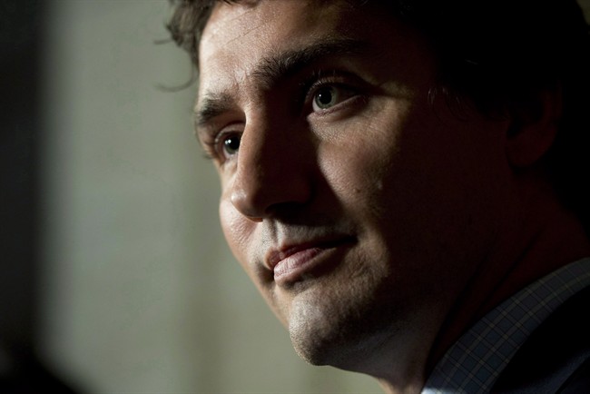Liberal Leader Justin Trudeau speaks with the media following party caucus in Ottawa on October 8, 2014.