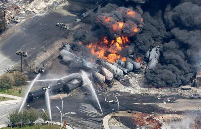 Smoke rises from tanker cars in downtown Lac-Megantic, Que., on July 6, 2013. 