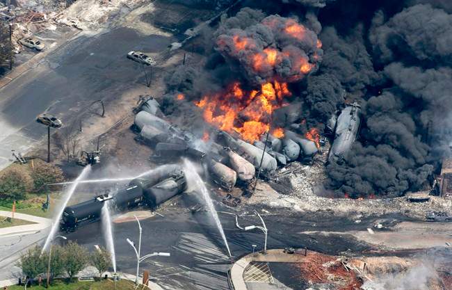 Smoke rises from tanker cars in downtown Lac-Megantic, Que., on July 6, 2013. 