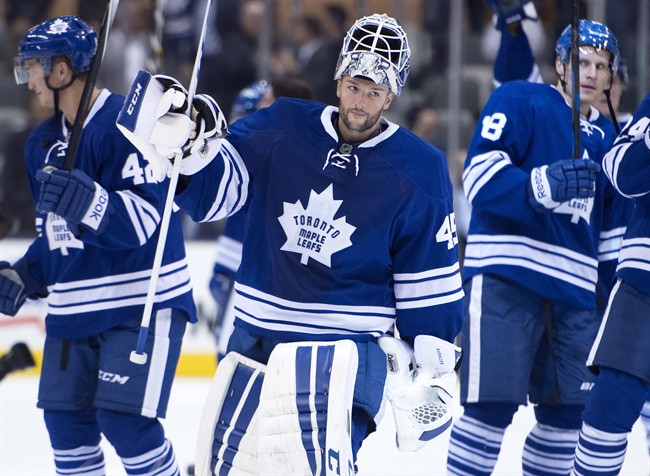 Toronto Maple Leafs goaltender Jonathan Bernier salutes the crowd after a 4-0 win over the Buffalo Sabres in NHL action in Toronto on Tuesday October 28, 2014. THE CANADIAN PRESS/Frank Gunn.