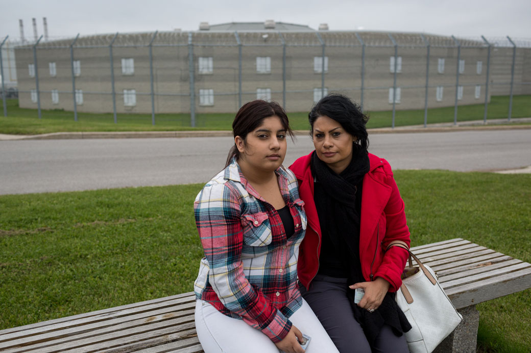 Pam Shiraldini and Melika Mojarrab, 15, sit in front of the Lindsay jail after visting Masoud Hajivand. “It makes me concerned,” Pam says. “He has no criminal (background) and he’s in a maximum-security facility here in Lindsay. He’s locked down most of the time, so it’s a very stressful time for us, and also for him too. I’m concerned about his safety inside the jail.”.