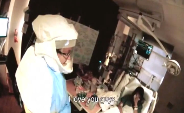 In this frame grab taken from video provided by Texas Health Resources, Nina Pham, right, who contracted Ebola after treating a Liberian man, wipes her face as she talks to her coworkers at Texas Health Presbyterian Hospital in Dallas, Thursday, Oct. 16, 2014, before being flown to the National Institutes of Health outside Washington.