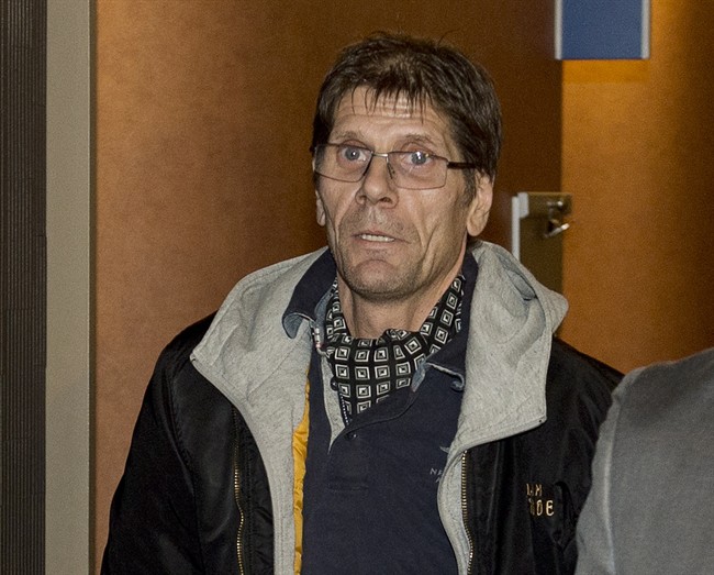 Witness Frank Rubert, from Berlin, leaves the courtroom after testifying at the murder trial for Luka Magnotta Wednesday, Oct. 8, 2014 in Montreal.