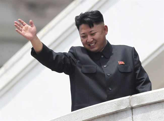 FILE - In this July 27, 2013 photo, North Korean leader Kim Jong Un waves to war veterans during a mass military parade celebrating the 60th anniversary of the Korean War armistice in Pyongyang, North Korea.