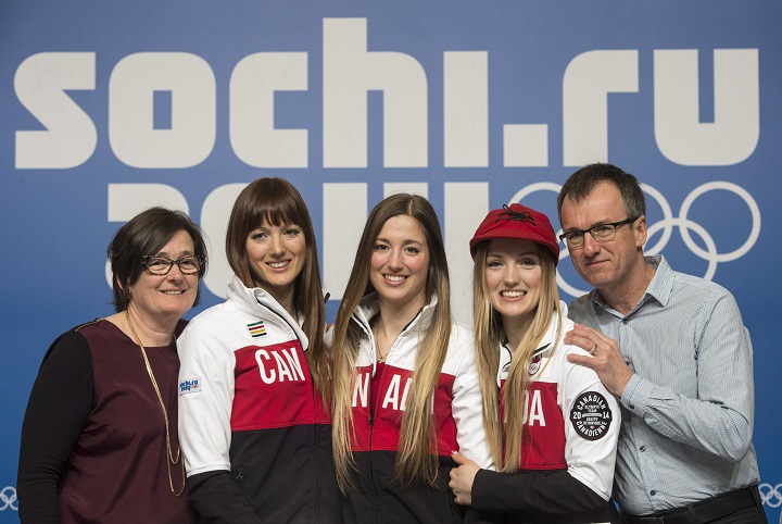 Women's moguls Olympic gold medalist Justine Dufour-Lapointe, second from right, poses with her sister and silver medalist Chloe, centre, and her other sister Maxime and mother Johane Dufour and father Yves Lapointe at the Sochi Winter Olympics in Sochi on Sunday, February 9, 2014.