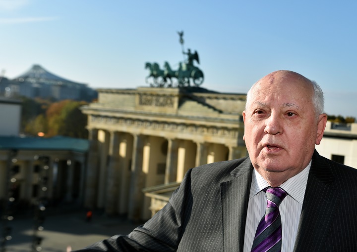 Former Soviet Leader Mikhail Gorbachev stands in front of the Brandenburg Gate in Berlin, Germany, Saturday, Nov. 8, 2014. 